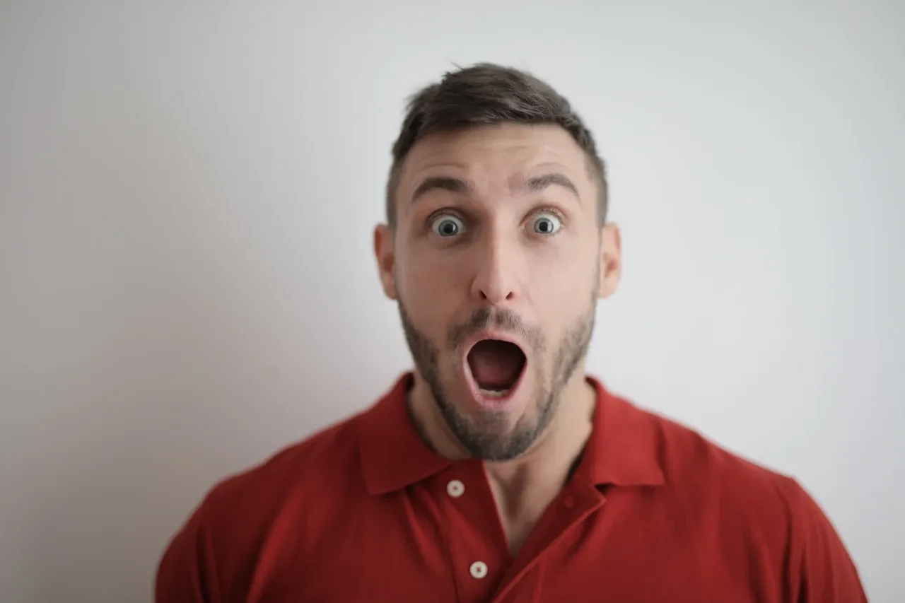 A man with a surprised expression