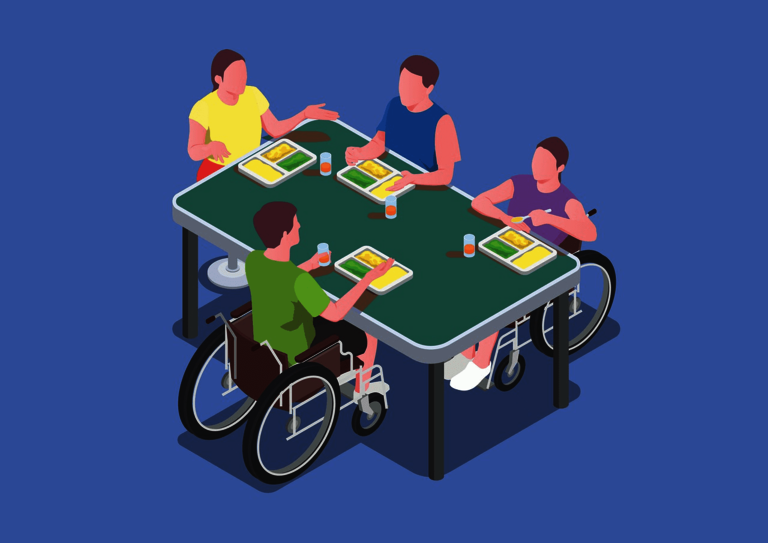  Four people eat at one table, two of them in wheelchairs