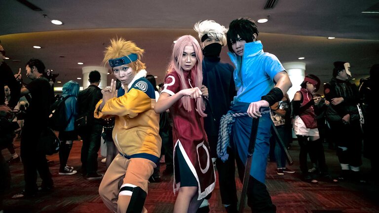 Cosplayers costumed, as characters from the anime "Naruto," at a convention (Photo by Donald Tong - pexels.com)
