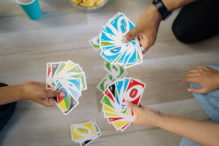 Multiple people with with Uno-cards