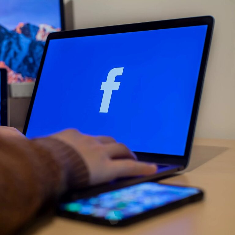 Screen with Facebook logo